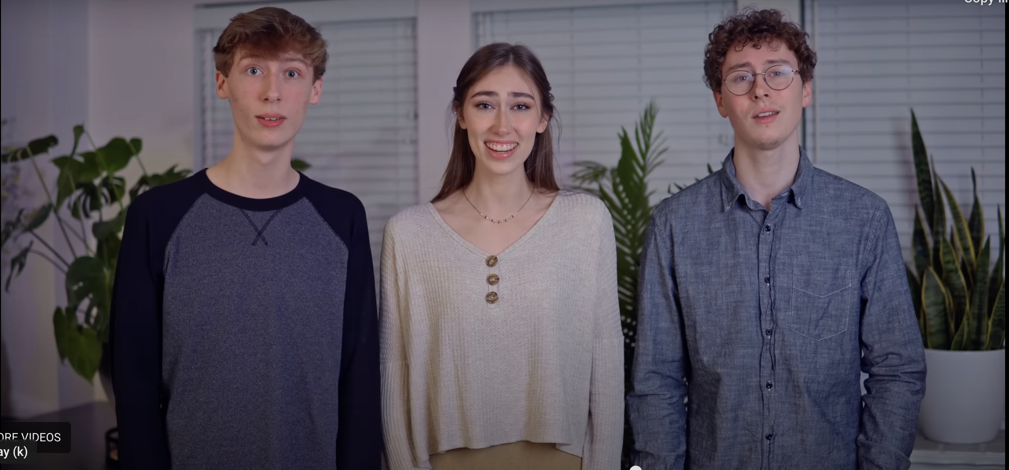 Three teen siblings singing in harmony