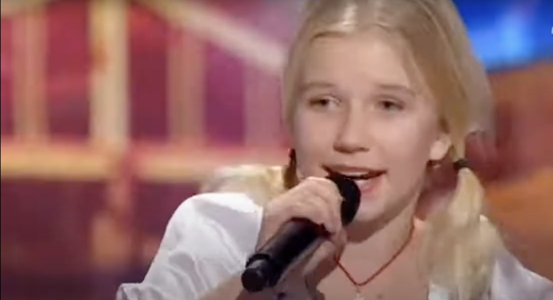 11-year-old blonde girl yodeling at TV competition