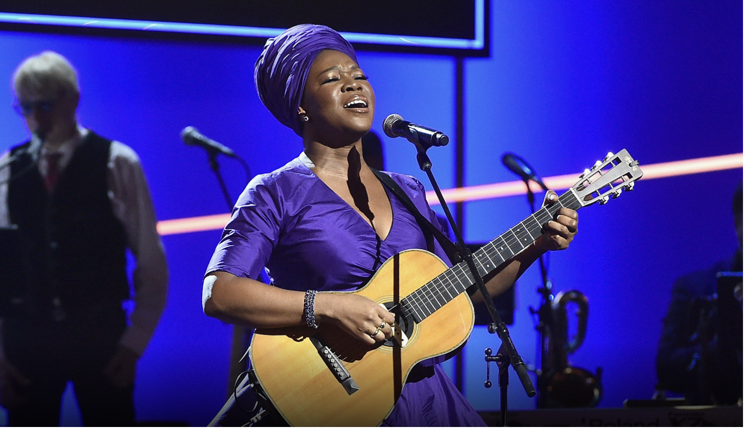 Singer/guitarist India Aire performing at the Grammy awards in brilliant purple dress